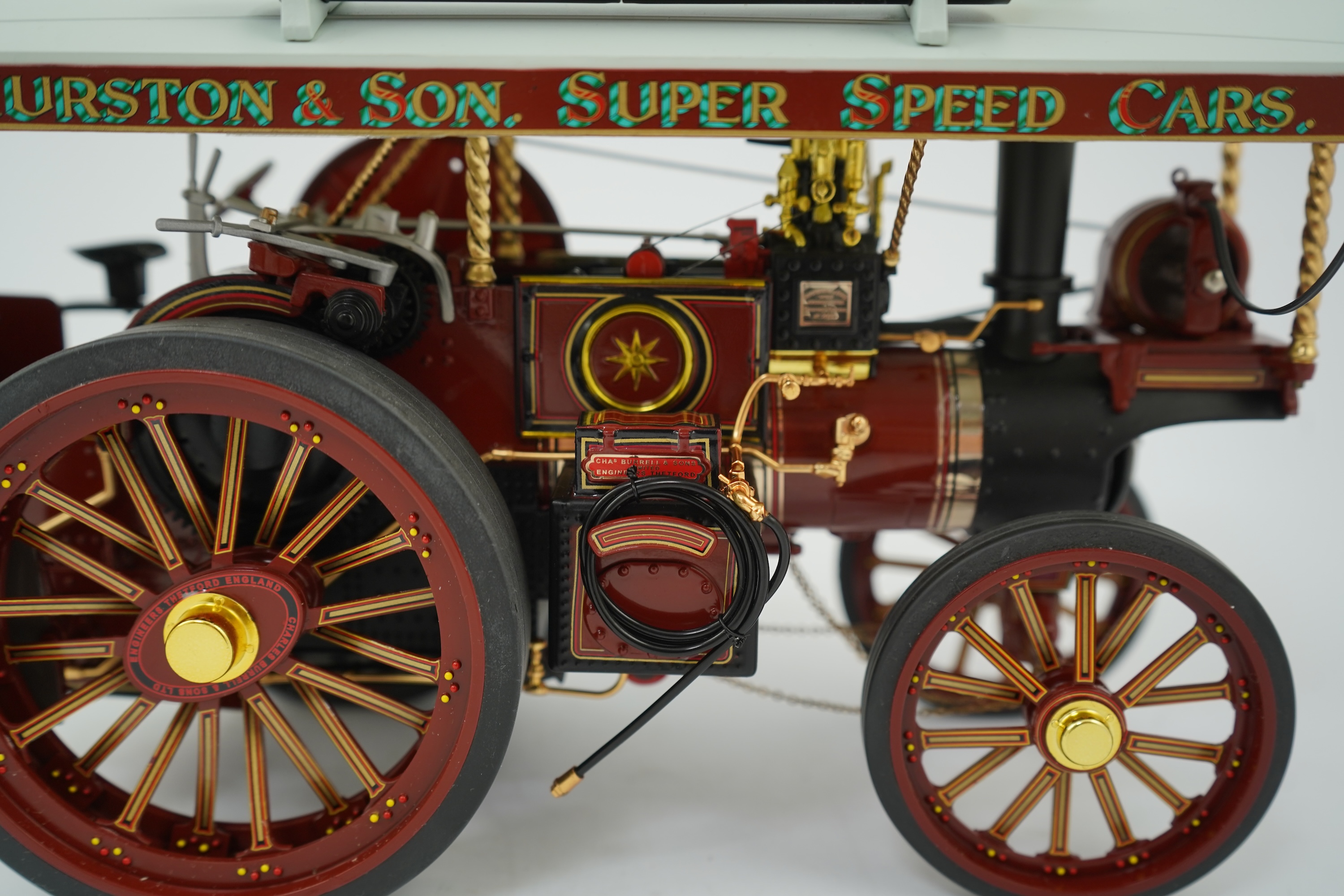 A Midsummer Models Ltd. 1:24 scale model of a Burrell Showman’s Engine, Britannia, in William Thurston and Son. Super Speed Cars livery, missing the original card box, but with an oak and Perspex display case